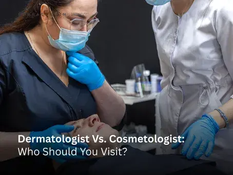 A close-up of a medical professional in a mask and blue gloves examining a patient's face, featuring the text overlay "Dermatologist Vs. Cosmetologist: Who Should You Visit?"