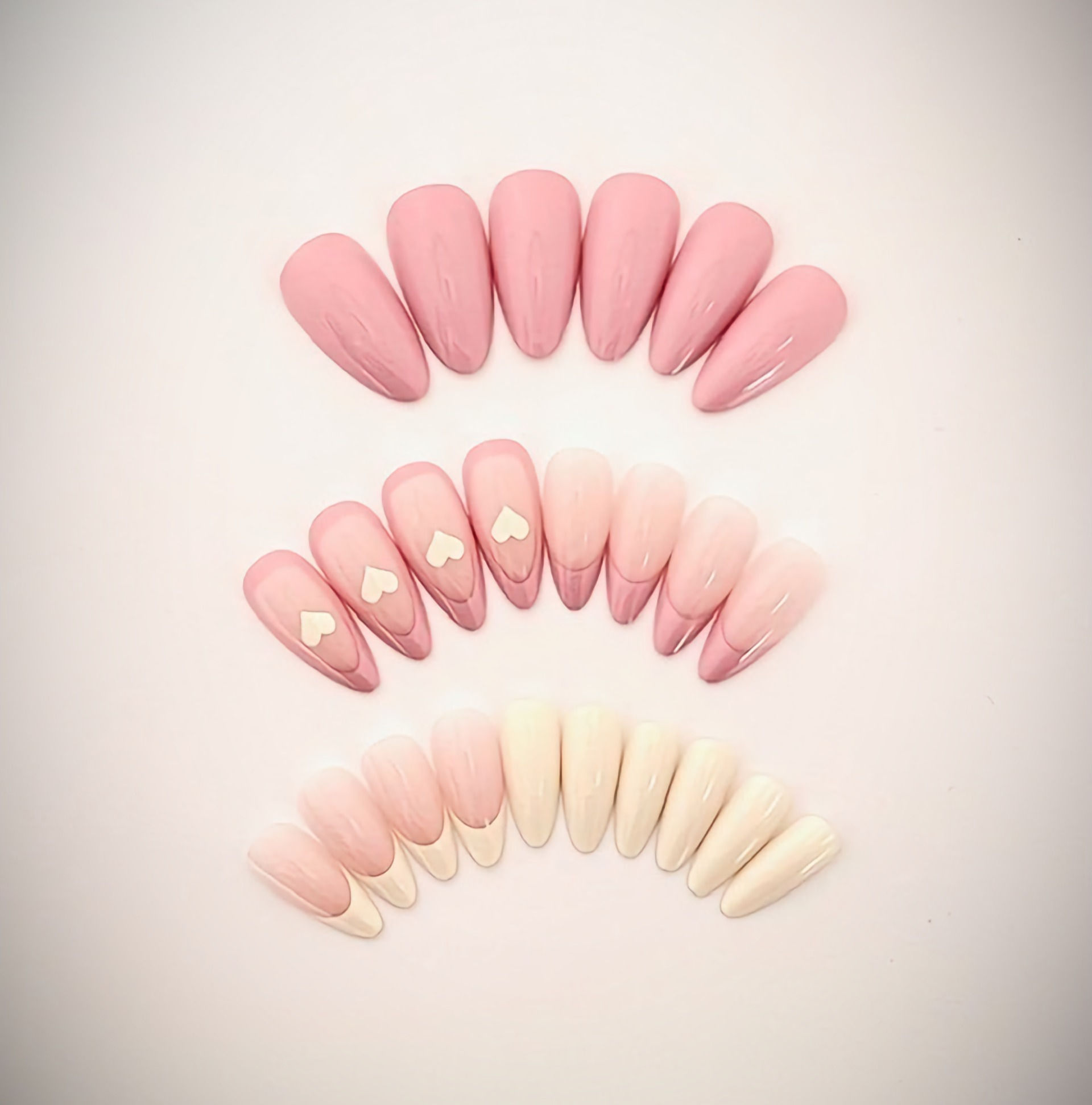 The Linda set a stunning combination of blushing peach tones and pastel yellow featuring French tip and heart designs