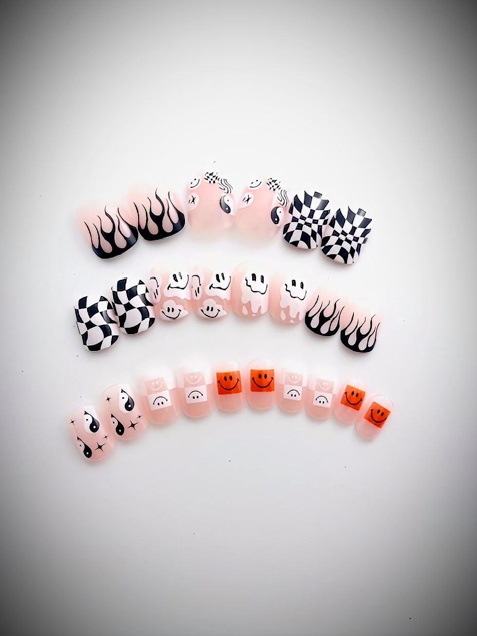 The Jean design features a mix of wonky checkerboard, ghost, smiley faces and ying yang designs