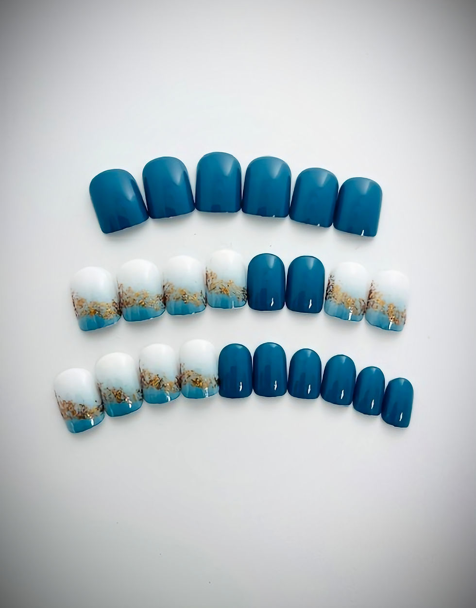 Carissa - Ocean Blue press on nail set featuring beautiful blue ombre, white and gold accent nails