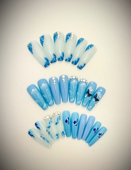 The Debi set features beautiful white frosted design with striking blue glitter accents, butterflies and rhinestones