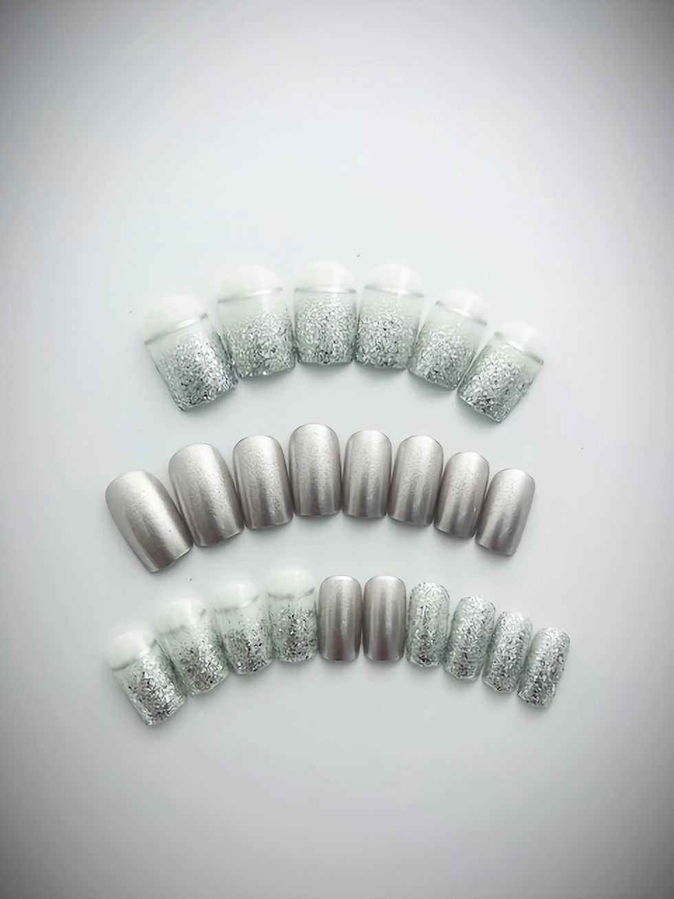 Sylvia is a silver design featuring French Tips, Silver Glitter and Ombre designs