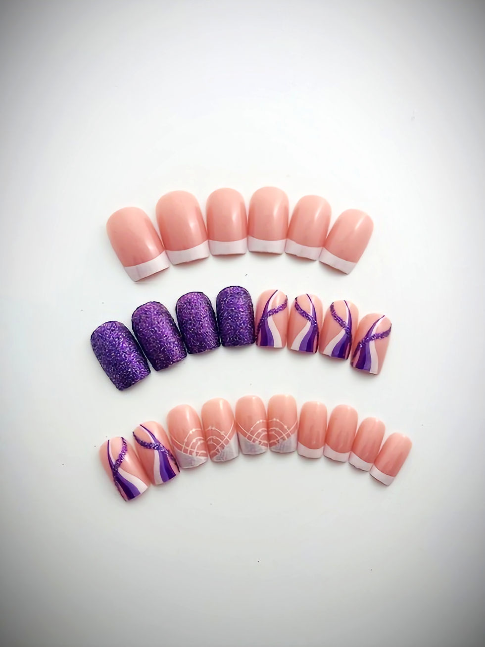 The Violet set features French tip designs as well as purple glitter and flirty line designs