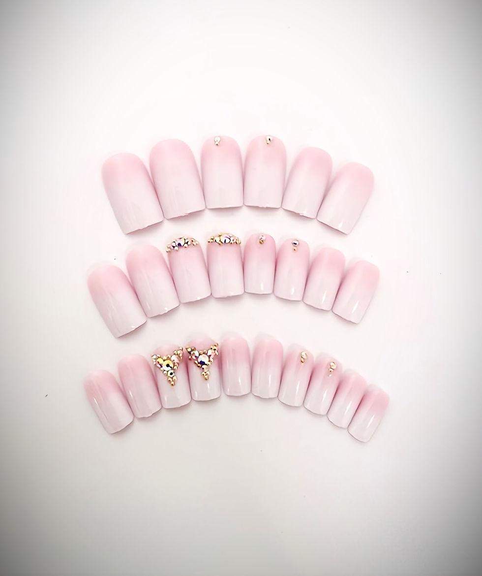 The Andrea design features a very soft pink to white ombre design with accent nails  sparkling with beautiful rhinestones