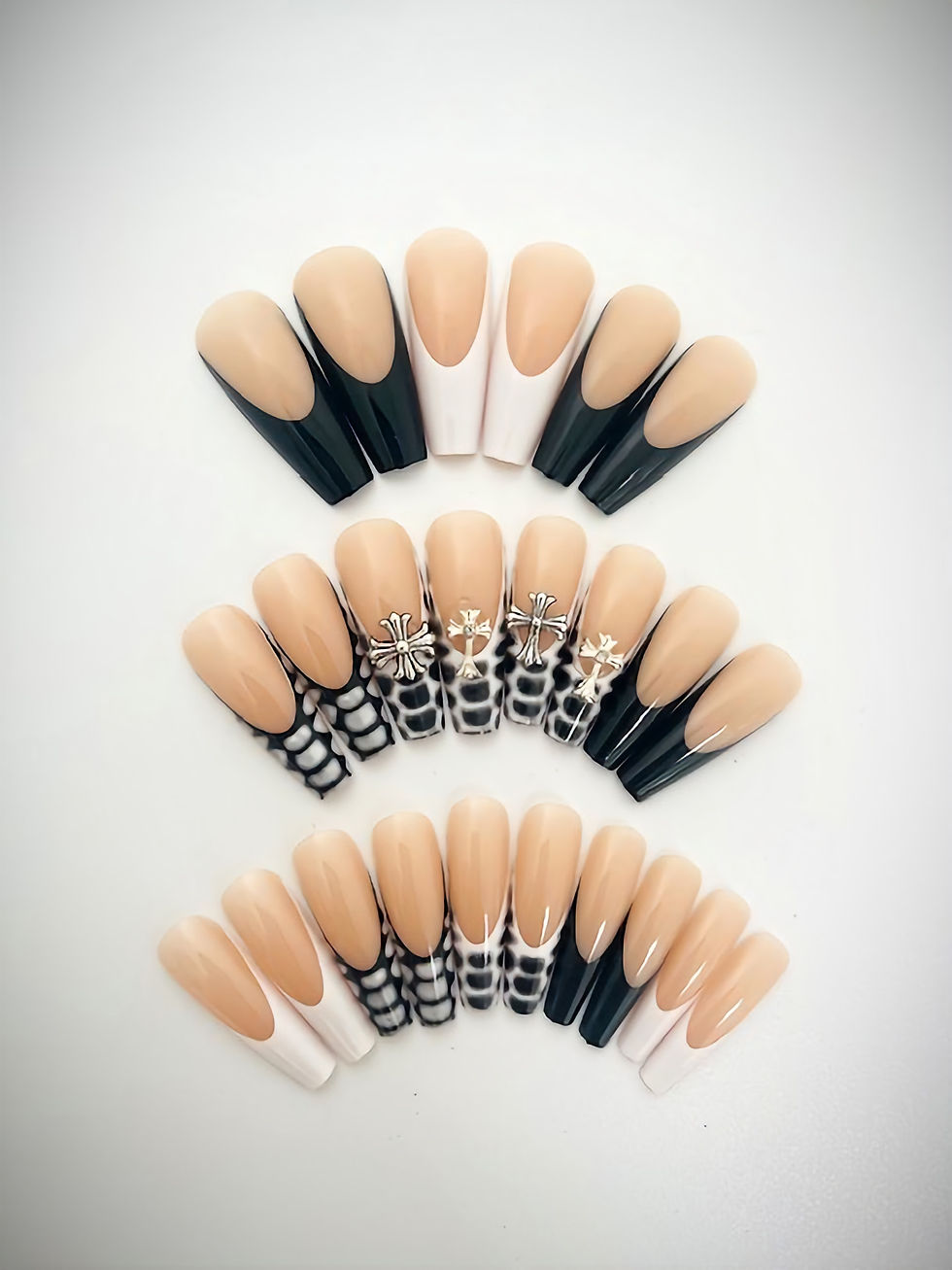 The Nyla set features a nude base with a selection of chic French tip designs, including trendy snake print designs