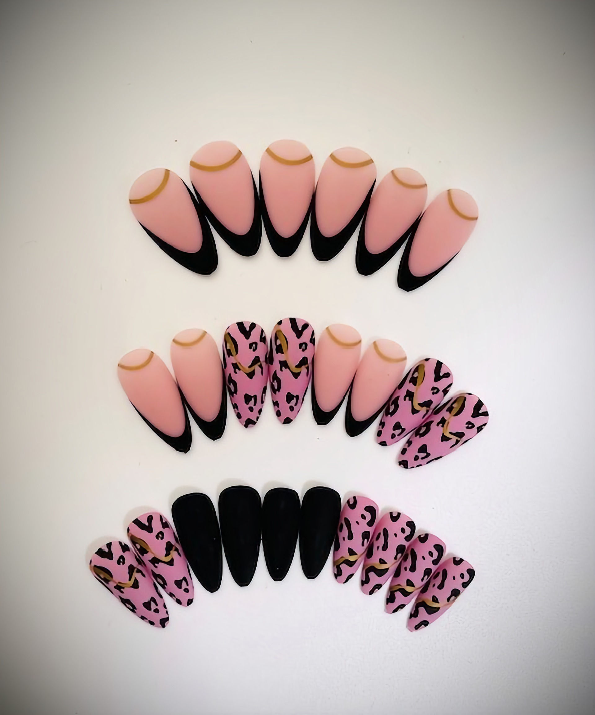 The Jane set features a almond shape French tip, gold accents and cheetah prints