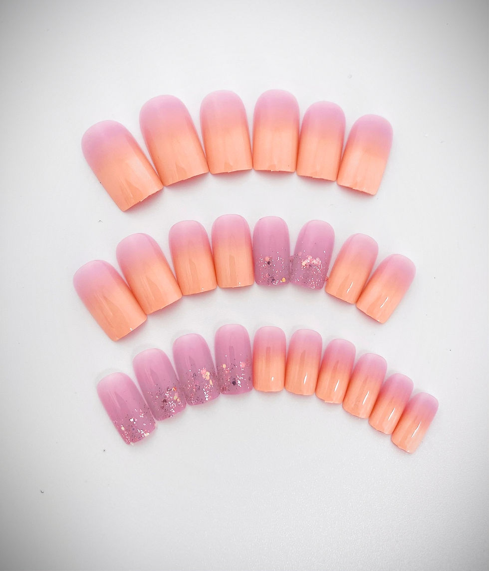 The Layla design features a lilac and orange ombre with glitter accent nails