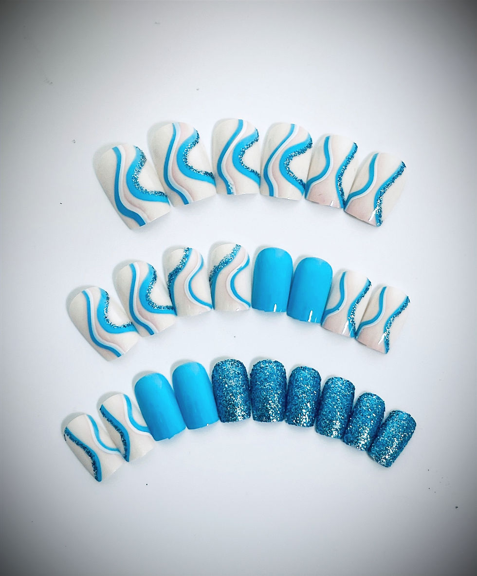 The Bailey set features a pearly white base with hues of pink and aqua wavy line accent nails