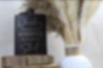 Black personalized whiskey flask with custom quote design.