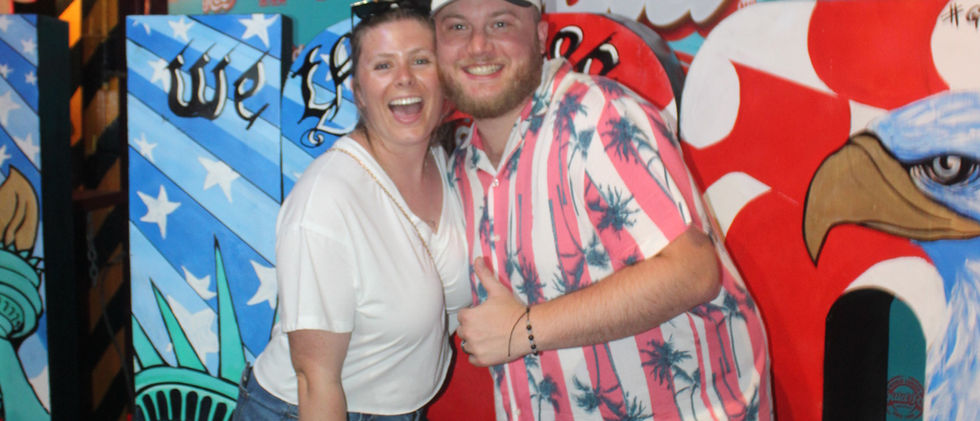 Couple posing at El Squid Roe Fourth of July party