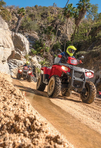 Group of ATVs ridding through the desert of Cabo, Mexico.