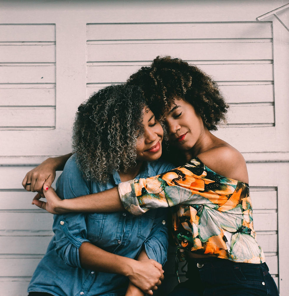 Mother giving daughter a hug.