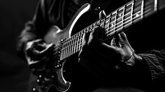 black-white-view-person-playing-electric-guitar_23-2151406203.jpg