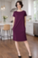 Model wearing Mulberry Simone merino jersey shift dress above the knee.