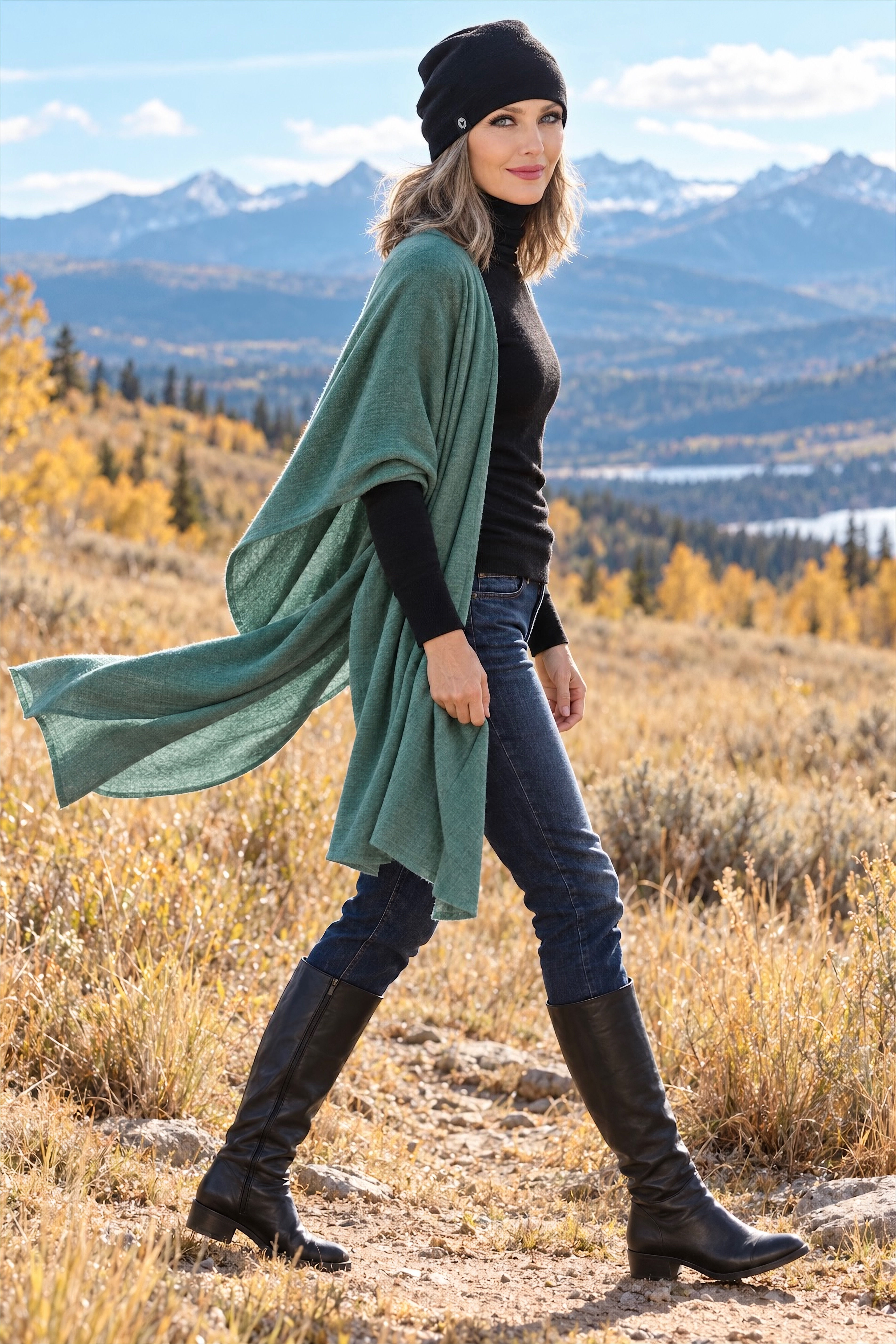 Model styling dusty teal green mid-weight merino rib wrap and scarf in relaxed outdoor fall pose. 4️⃣