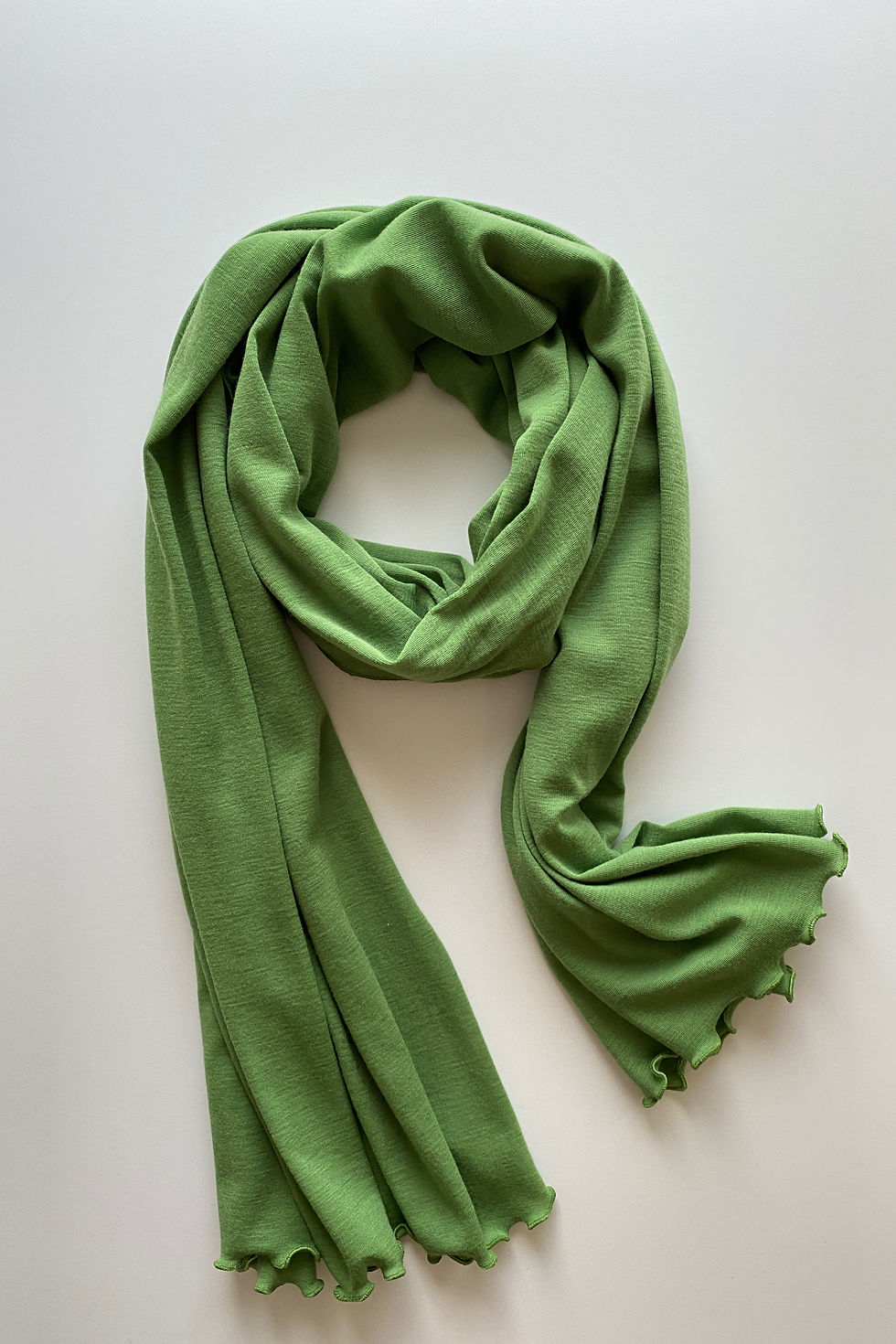 Thumbnail: Merino Travel Wrap and Scarf in apple green mid-weight rib merino wool displayed as a product shot.