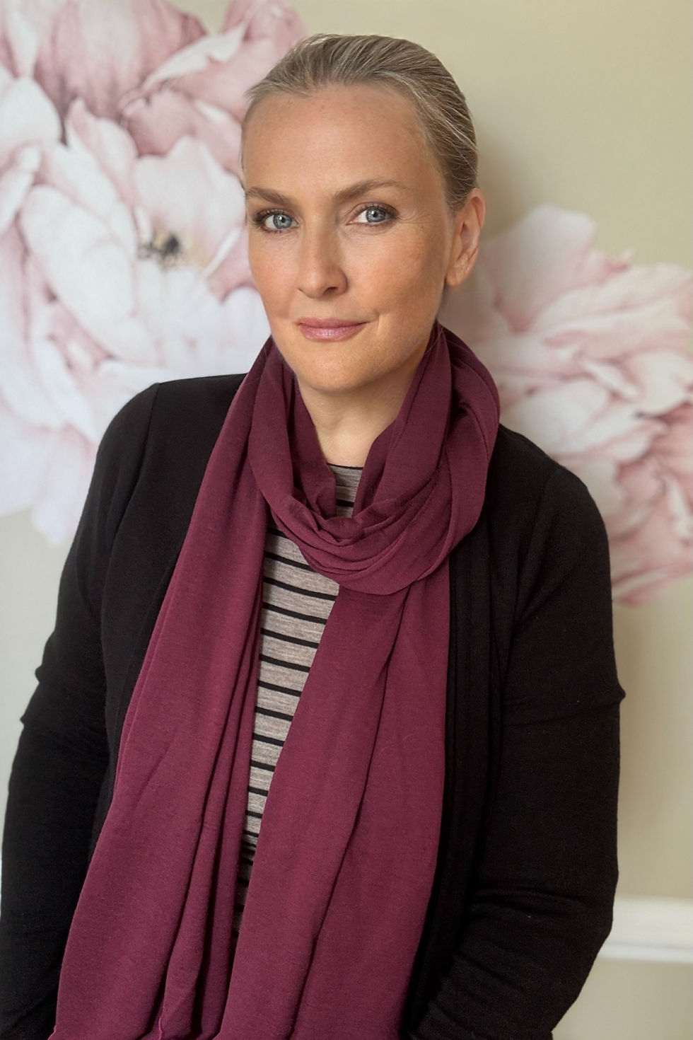 Thumbnail: Woman wearing the mulberry Merino Travel Wrap and Scarf in a relaxed lifestyle pose.