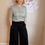 Thumbnail: Black Celeste merino wool wide leg crop pants worn by model.