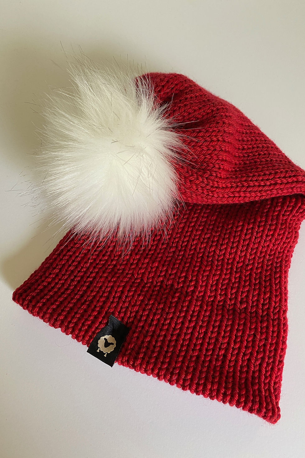 Thumbnail: SANTA Pom Beanie in Christmas red with white pom shown folded, highlighting shape and texture.