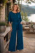 Woman wearing the Sierra Atlantic blue merino jersey jumpsuit in a relaxed lifestyle pose.