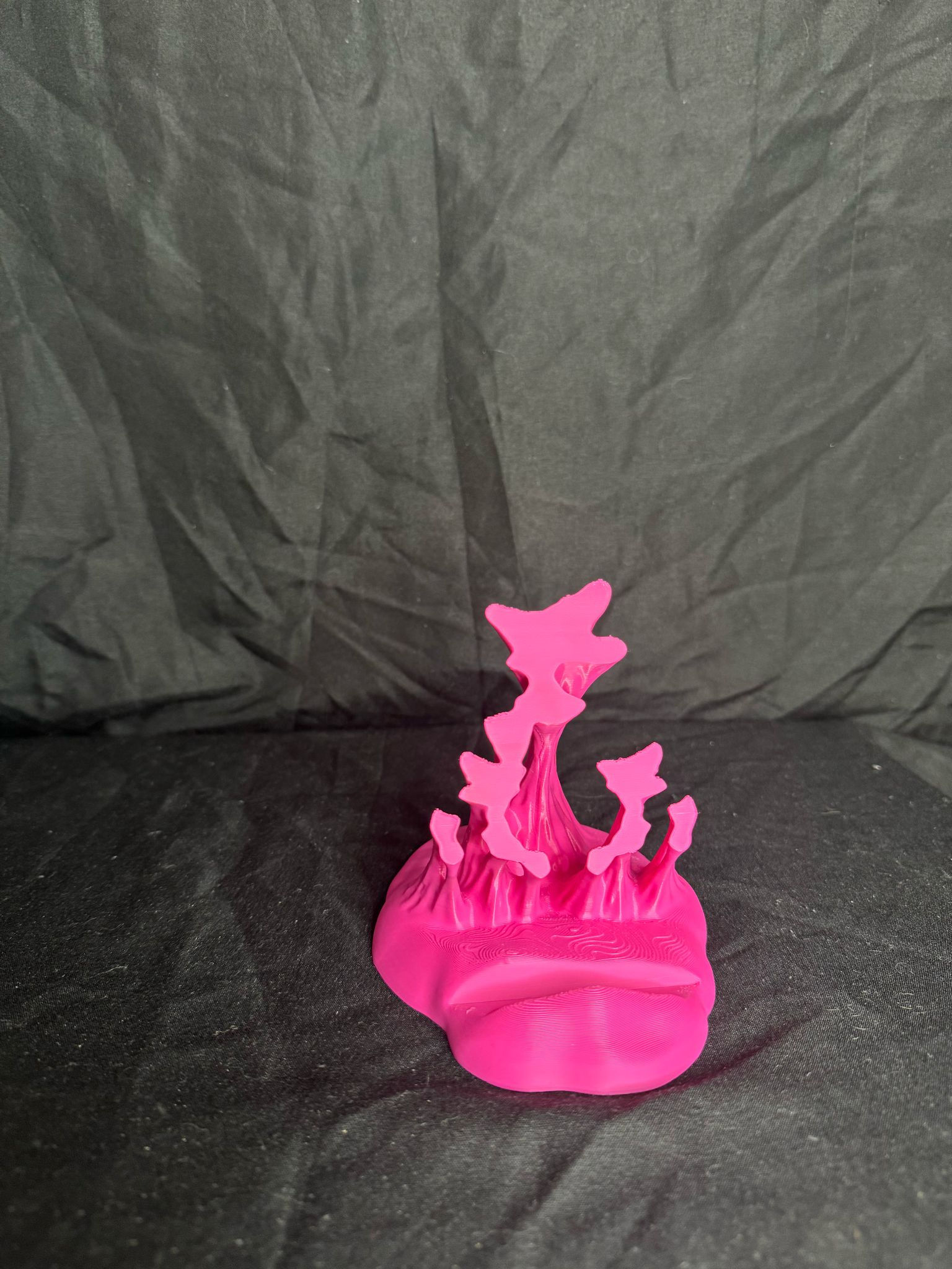 Front view of a 3D printed ‘Sticky’ phone holder on a white background