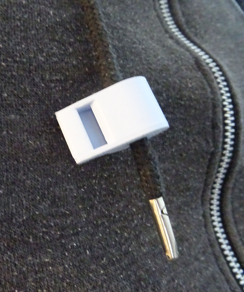 Thumbnail: Close-up of a 3D printed whistle threaded onto a hoodie drawstring