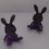Thumbnail: a pair of threadful bunnies in partial darkness