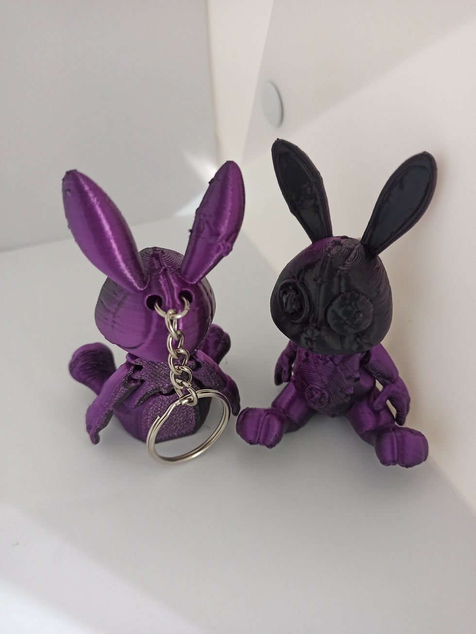 Thumbnail: a pair of threadful bunny keyrings