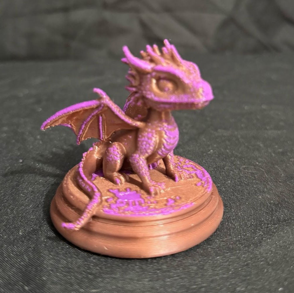baby dragon on base side view