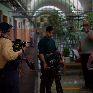 Film crew filming inside prison