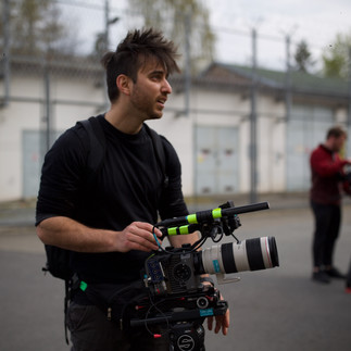 Filmmaker with camera on location