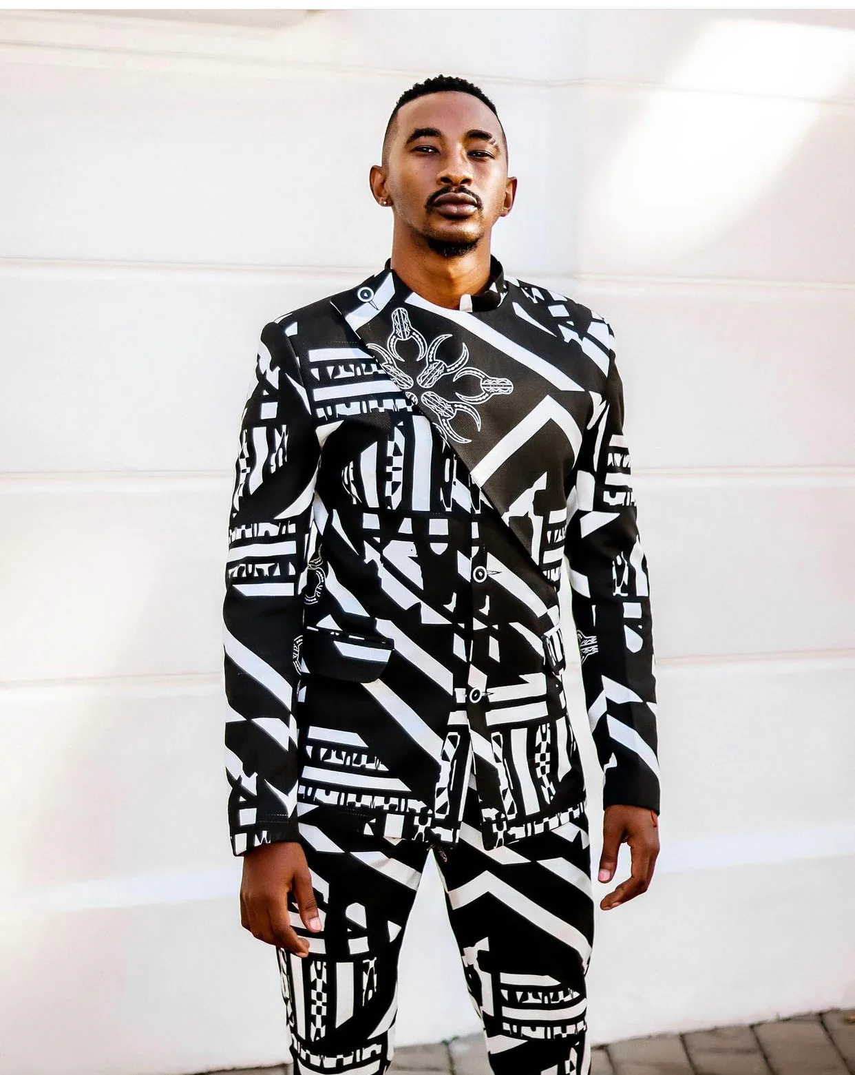 Embossed fabric in an Imprint print creating a 3D effect. Pleated dress with a drop waist effect. 