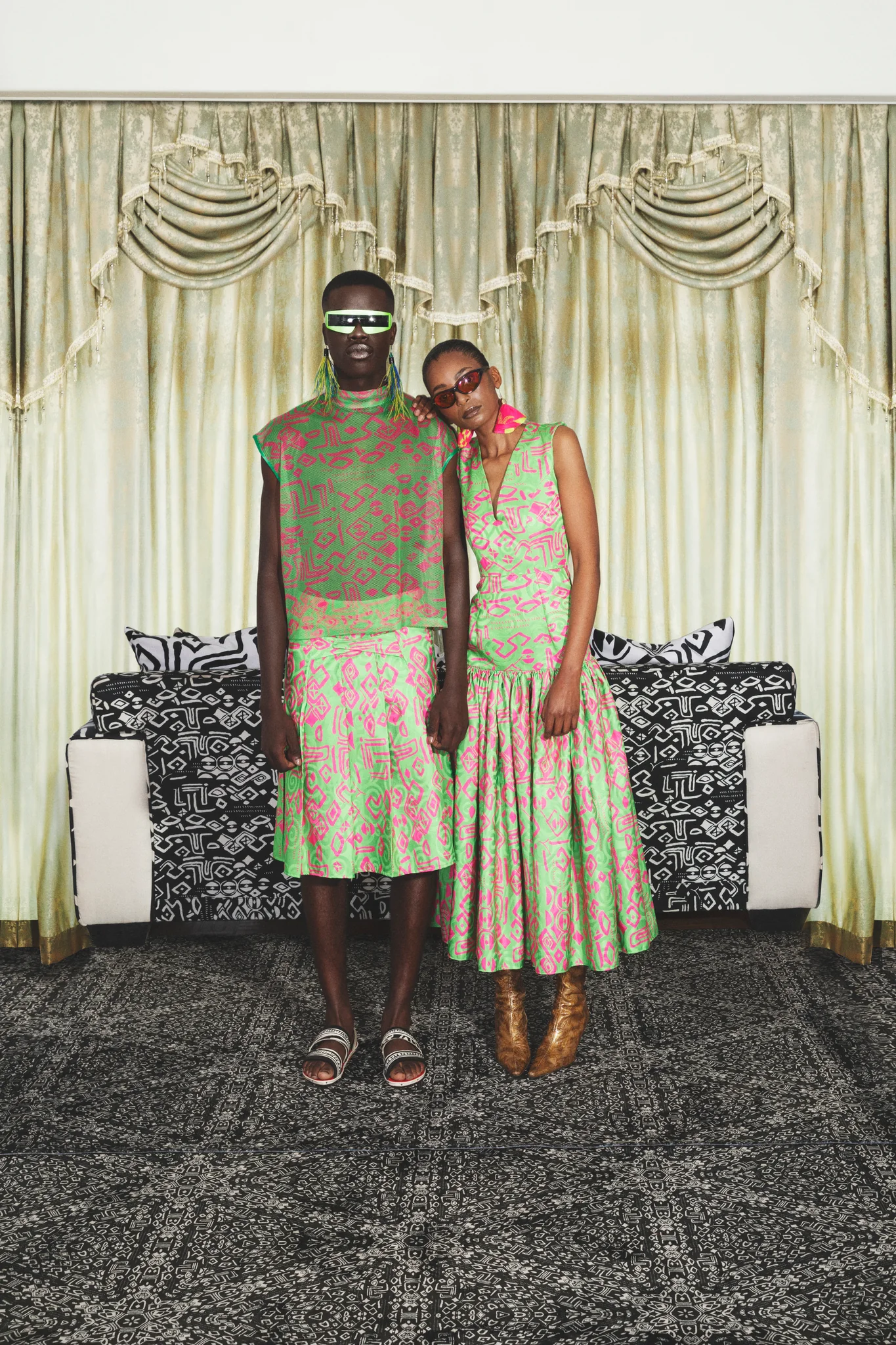 Embossed fabric in an Imprint print creating a 3D effect. Pleated dress with a drop waist effect. 