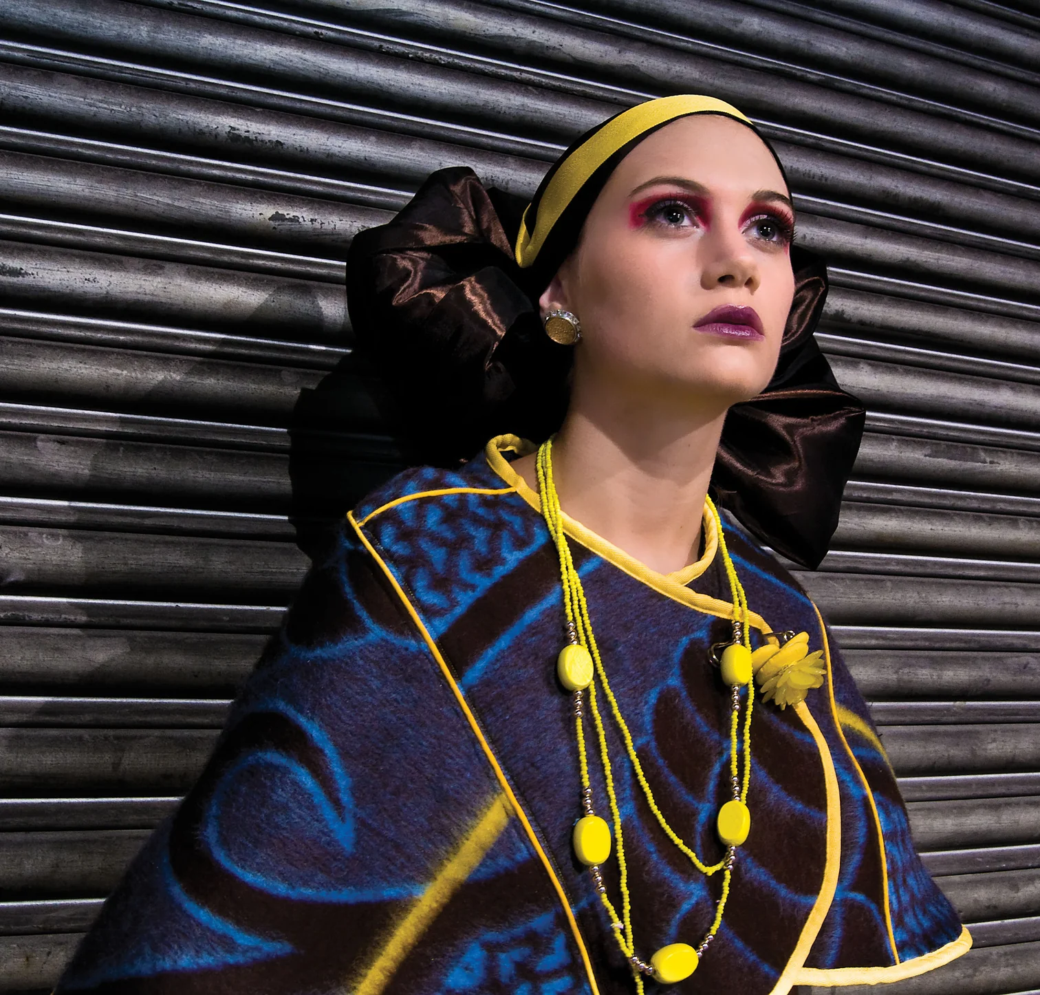 The Kobo Poncho is an easy wearing, asymmetrical cape made from the wool Basotho Blanket. It feature