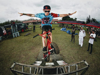 Confident man on bike doing tricks
