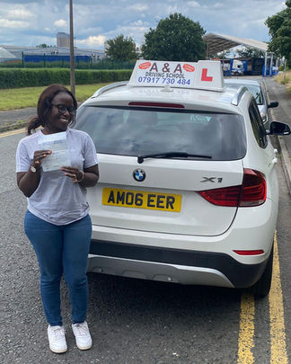 Happy learner after passing driving test with A&A Driving School instructor