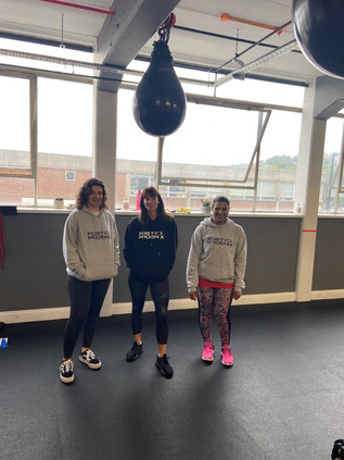 Fort Phoenix members in branded hoodies, posing at the gym.