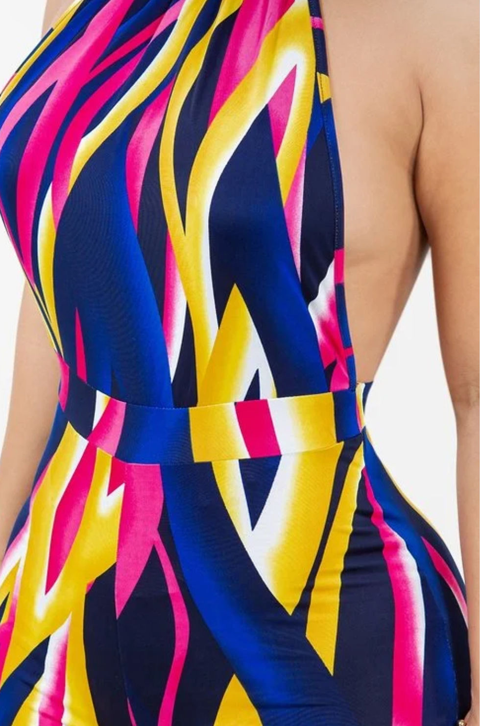 Thumbnail: Close up of woman wearing colorful jumpsuit.