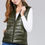 Thumbnail: Woman wearing light puffer vest in color olive.