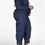 Thumbnail: Woman posing in denim jumpsuit showing side angle.