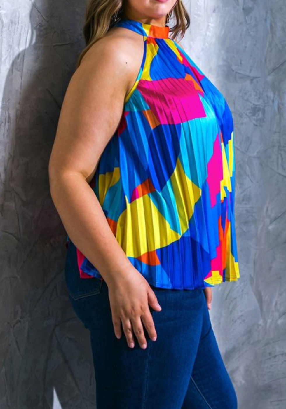 Thumbnail: Side view of woman in colorful blouse. 