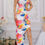 Thumbnail: Woman standing showing side view of dress.