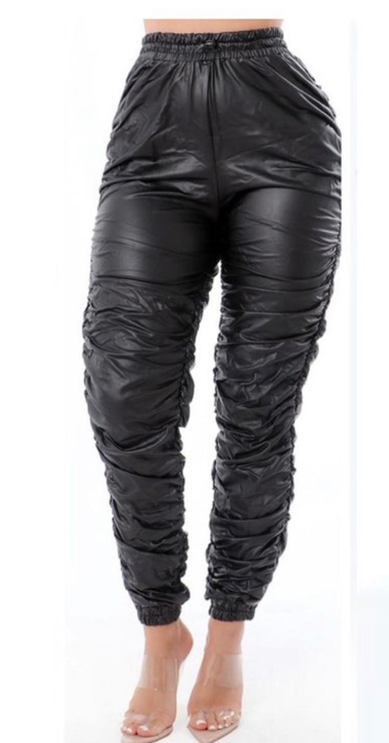 Thumbnail: Women's legs in black joggers.