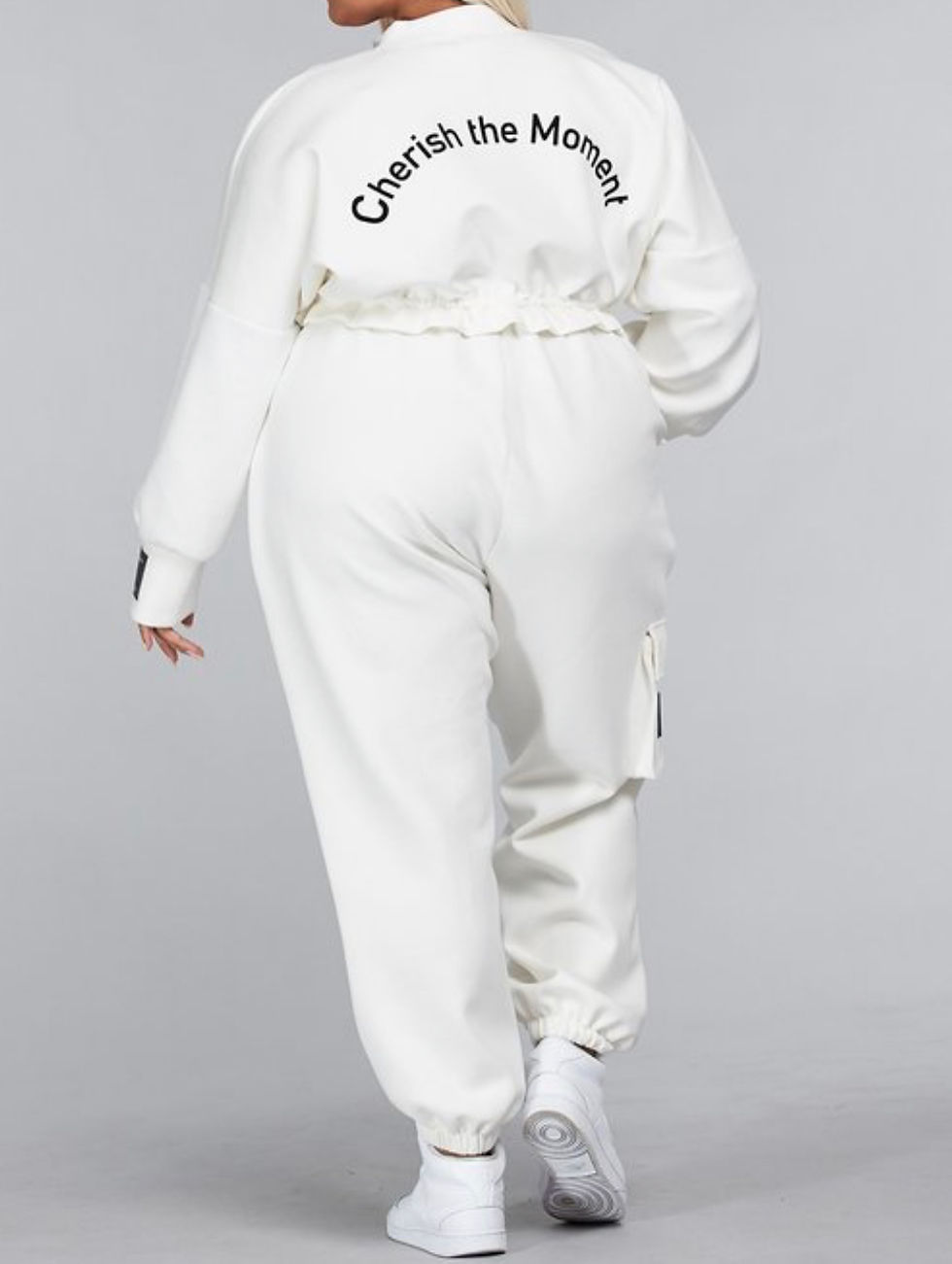 Thumbnail: Woman wearing jogger set showing back view of jogger set.