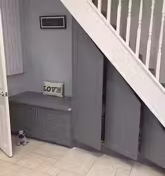 Built-in grey under-stairs storage cupboard unit