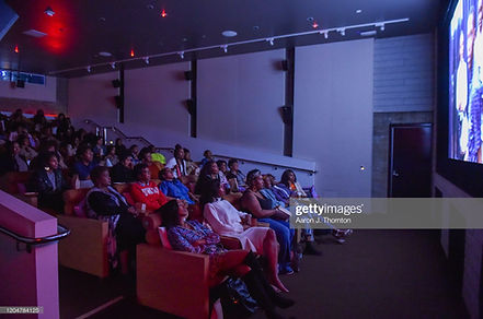 Audience members watch the screening of 'BET Twenties'