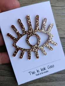 Pin's oeil doré fait main paillettes doré