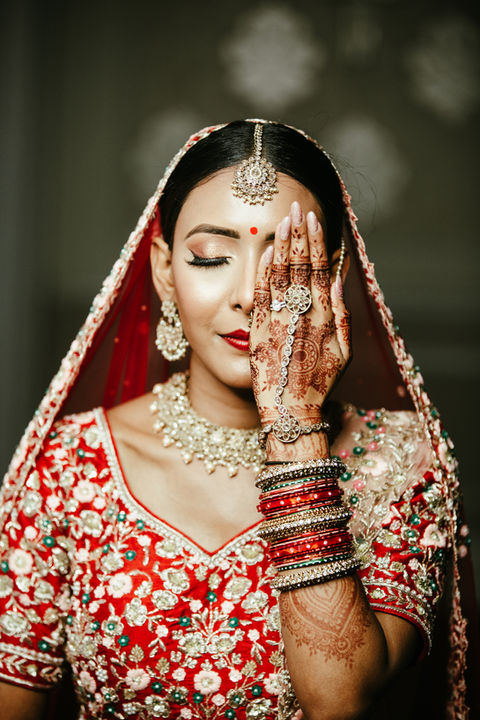 traditional 
one eye 
love 
red 
bangles 
matching 
earring 
veil 
tikka 
Bollywood 
contrast
glamour 
makeup 
