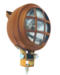 Faro auxiliar antiguo metálico con rejilla protectora, diseño industrial vintage.