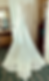 White wedding dress with buttons and lace train